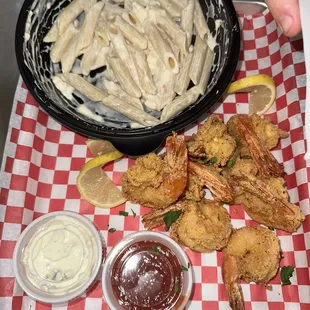 a tray of shrimp and pasta