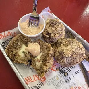 Pepper Jack stuffed boudin balls with remoulade.
