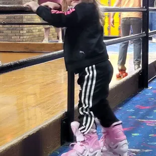 Trying her best to learn to skate.