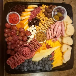 a platter of meat and cheeses