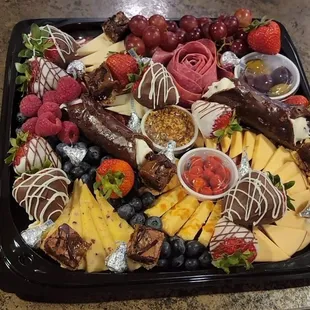a platter of fruit and cheese