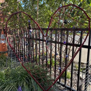 a heart shaped iron fence