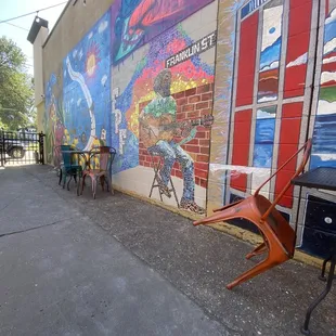 a colorful mural on the side of a building