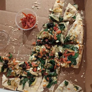 No toppings on a good portion of the pizza.