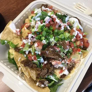 Carne Asada nachos on 10/11/16. Started digging in before picture oops
