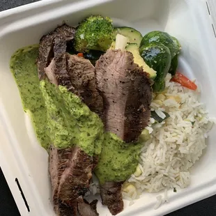 Grilled flank steak, rice pilaf, vegetables and chimichurri sauce ... delicious!!
