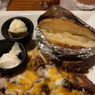 a plate of food and a glass of wine