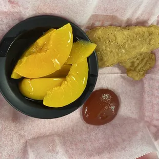 Kids chicken tenders and fruit.