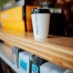 a cup of coffee on a shelf