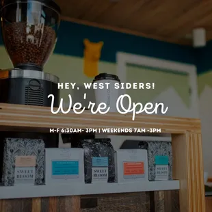 a display of coffee beans and coffee grinders