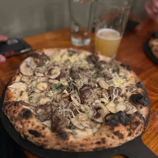  a pizza with mushrooms and onions