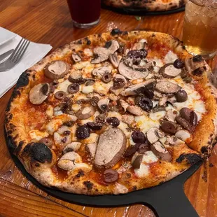 A delicious mushroom and olive pizza!