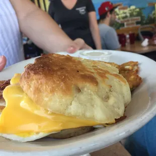 Breakfast biscuit sandwich with potato pancakes. Yum!! Biscuits made fresh each day!!