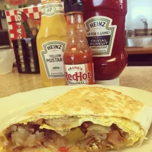 Breakfast burrito! Eggs, sweet peppers, potatoes, onions... Yum!