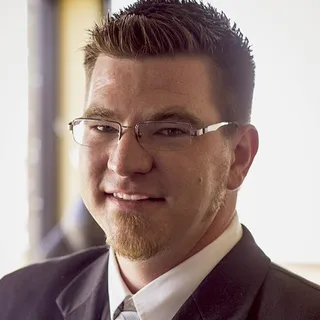 Nicholas E.