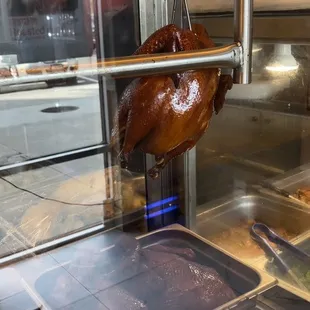 Single hanging Soy sauce chicken at 12:30PM