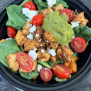 Roccos bowl with sweet potatoes, blackened chicken, guac, spinach and more