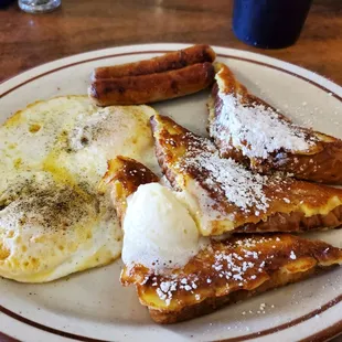 French toast, what happened to the 4th Triangle? Did the cook lose it or eat it? Cold sausage, under cooked eggs. 2lbs of butter.