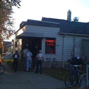 a group of people standing outside of a building
