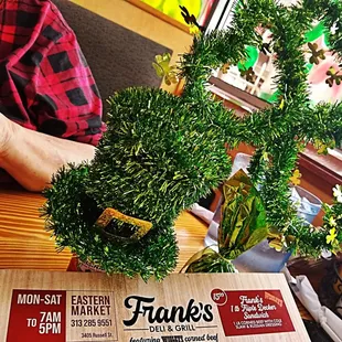 a man cutting a christmas tree