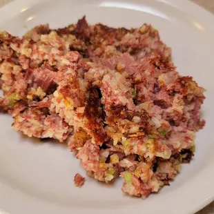 Side order of corned beef hash. It has onions and green peppers mixed in it.