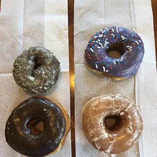 Chocolate cake, choc iced, purple with sprinkles, and original glazed