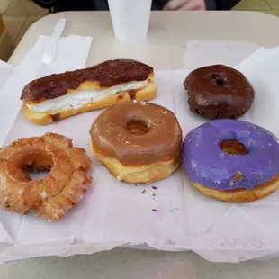 Old Fashioned, Maple, Cream filled Long John, Chocolate Cake, and Purple Frosted donut