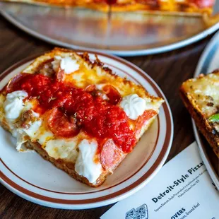 a slice of pizza on a plate