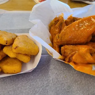 Left: mac&amp;cheese wedges. Right: one pound medium buffalo wings. It was 7 wings for me, sometimes its more or less so fair warning.