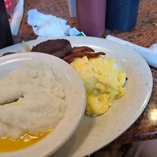 Sausage, bacon, hash browns, grits, and French toast