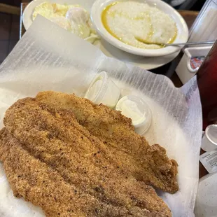 Fried fish with eggs and grits