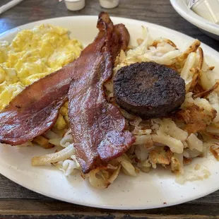 Breakfast special -scrambled eggs, bacon. Sausage, hash browns, French toast