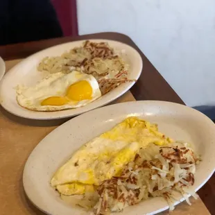 two plates of eggs and hash browns