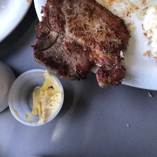 a steak and eggs on a plate