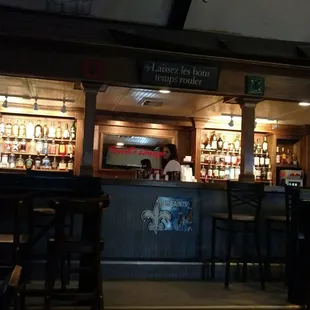 a bar with people sitting at it