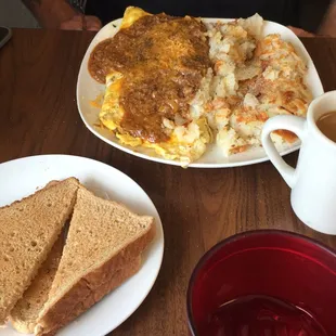a plate of food and a cup of coffee
