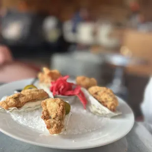 Cornmeal fried oysters with lemon aioli, pickled cabbage; and jalapeño