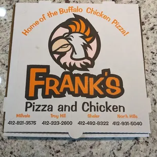 a sign for frank&apos;s pizza and chicken