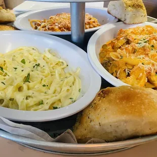 Pasta on the bottom tier with bread