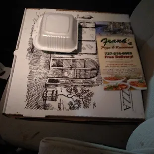 Picking up two pizzas from Franks to take home. They smell amazing.