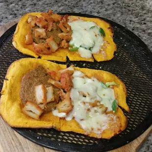 two slices of pizza on a grill