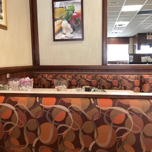 a dining area with tables and chairs