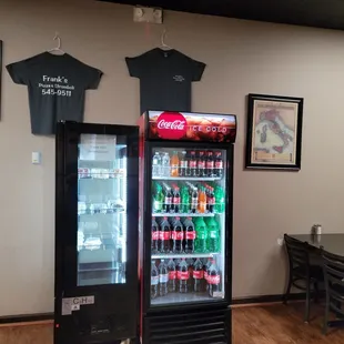 a t - shirt hanging on a refrigerator