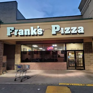 a shopping cart in front of a restaurant