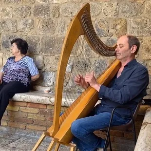 A gentleman in Italy playing the harp, which I associate with Italian food