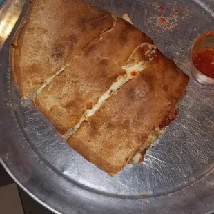 a pizza on a metal tray