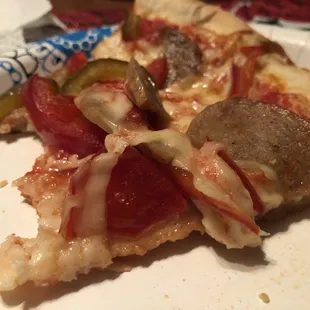 Large pizza with sausage and sweet peppers