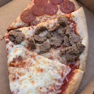 two slices of pizza in a box