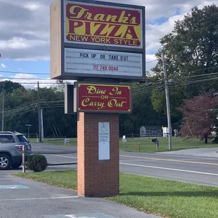 a sign for frank's pizza