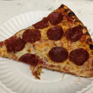 a slice of pepperoni pizza